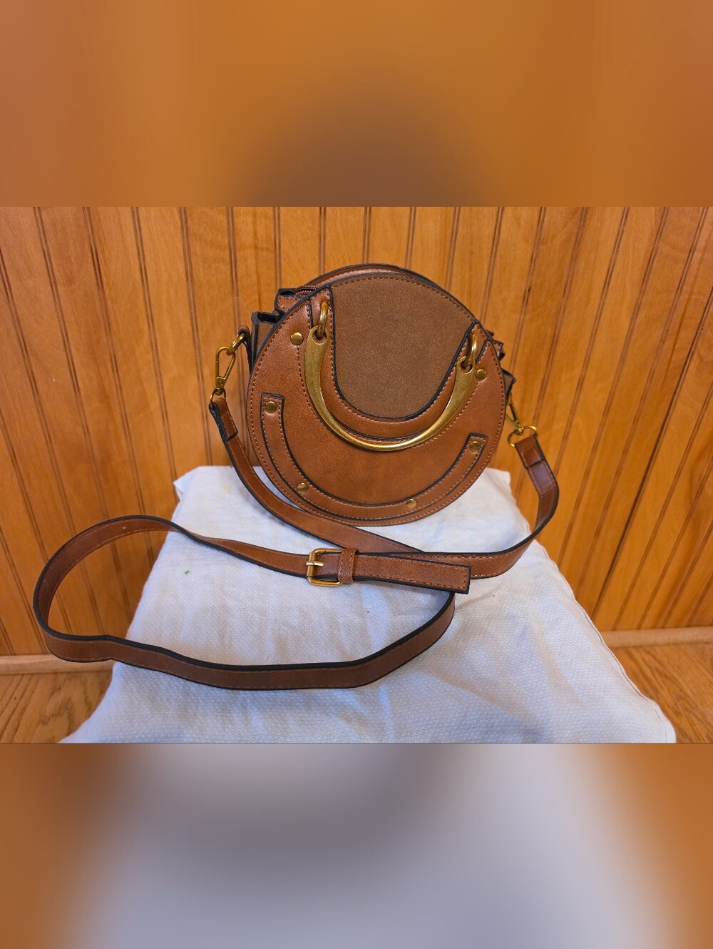 Round Brown Crossbody Bag with Gold Accent